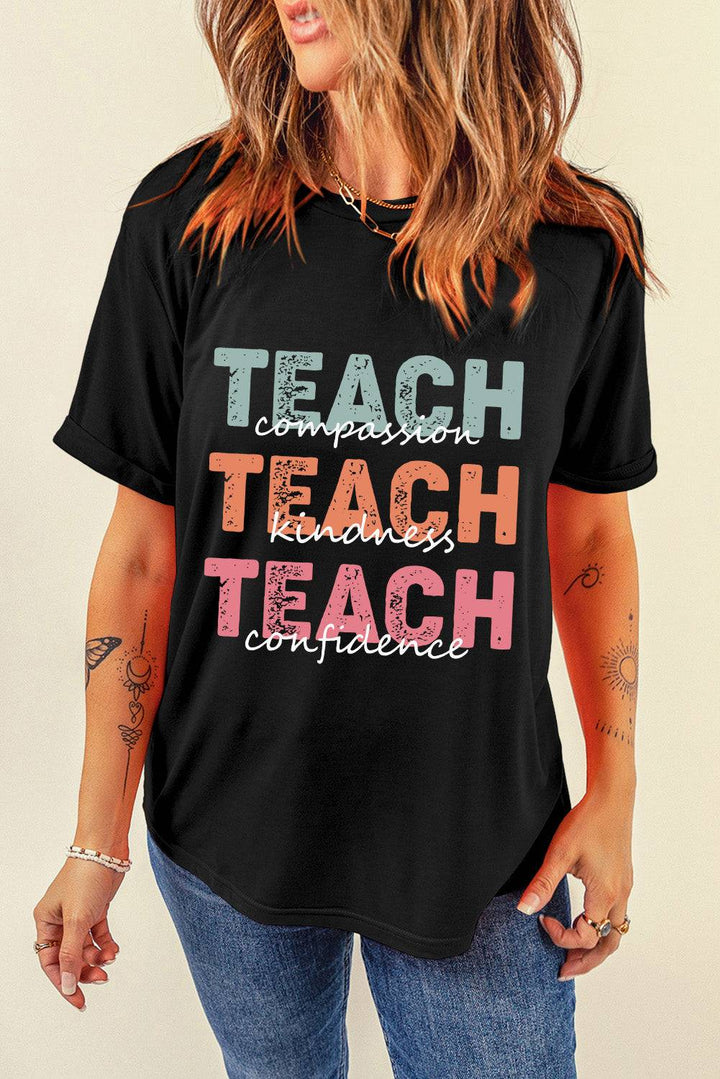 a woman wearing a black teach t - shirt