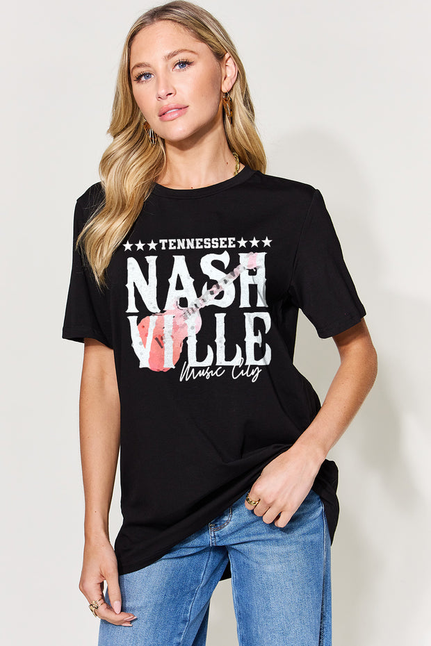 a woman wearing a black tee shirt that says nashville