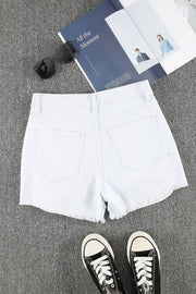 a pair of black and white sneakers and a pair of white shorts