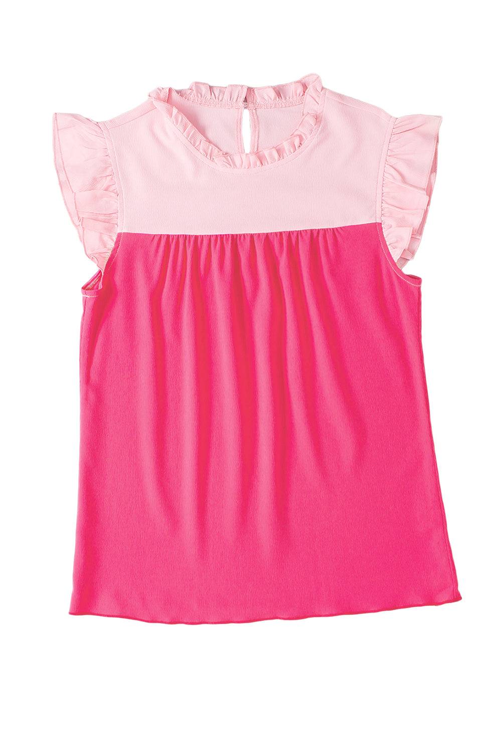 a pink and white top with ruffles on the shoulders