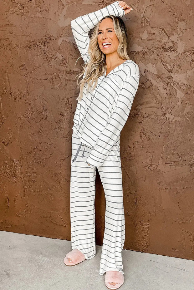 a woman in a white and black striped pajama set
