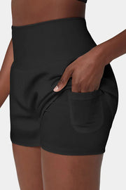 a woman wearing a black shorts with a pocket
