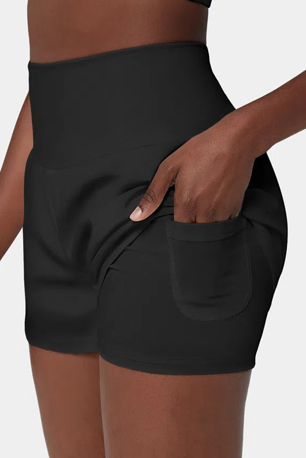 a woman wearing a black shorts with a pocket