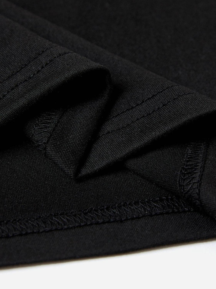 a close up of a black fabric with a white background