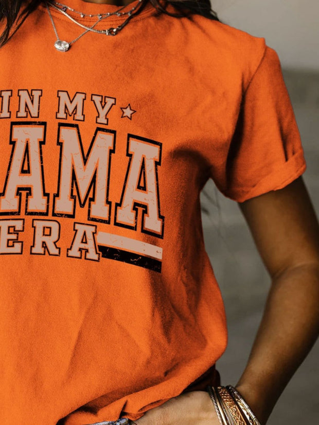 a woman wearing an orange shirt with the words jimmy obama on it