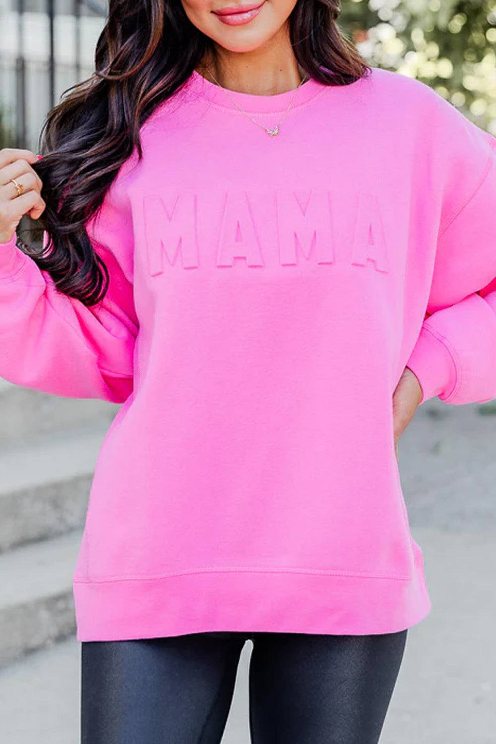 a woman wearing a pink sweatshirt and black leggings