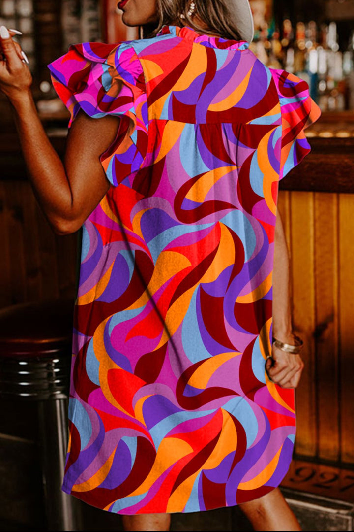 a woman in a colorful dress smoking a cigarette