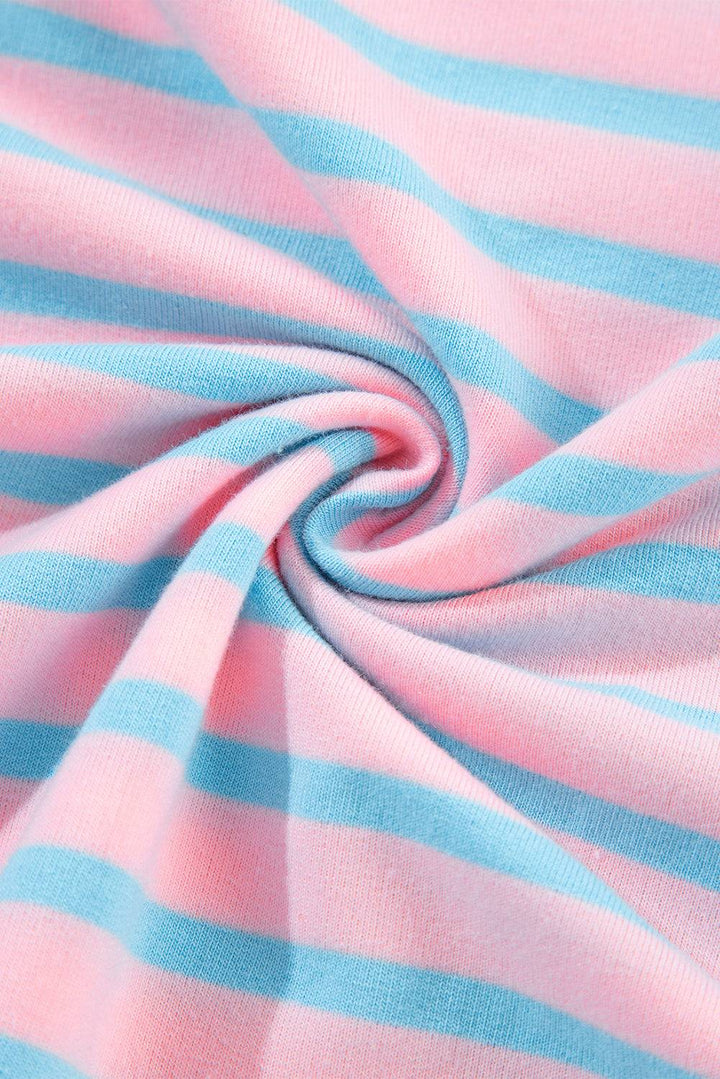 a close up of a pink and blue striped fabric