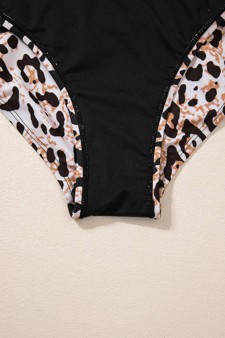 a bathing suit with a leopard print on it