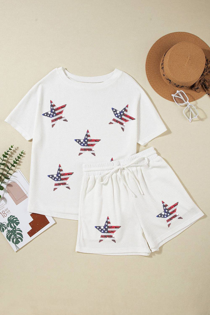 a white shirt and shorts with an american flag design
