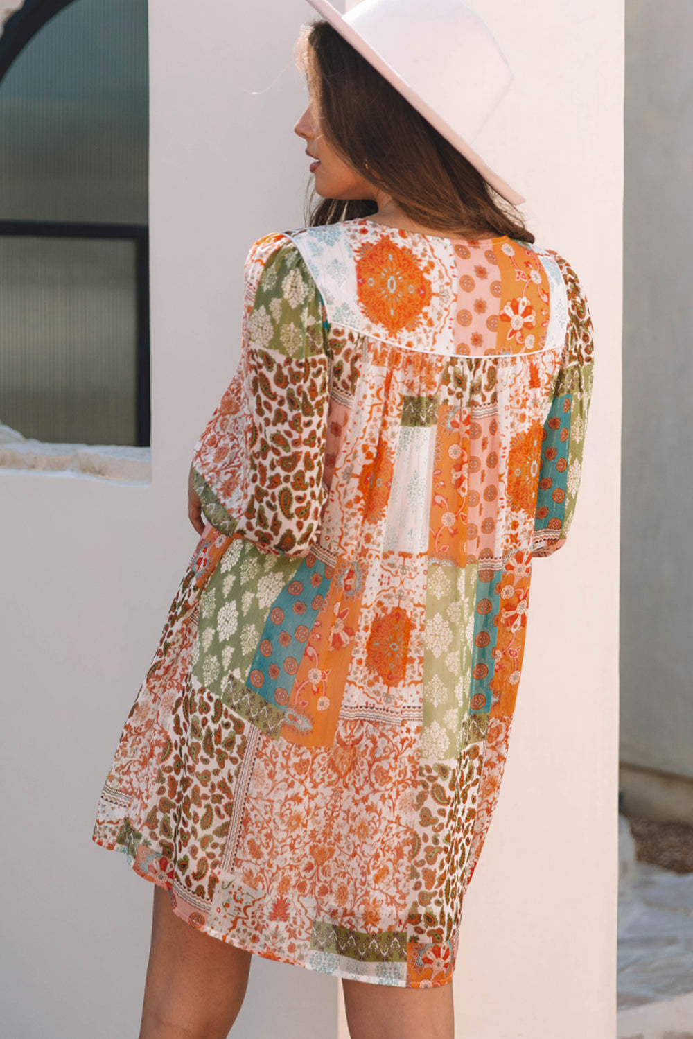 Back view of Orange Boho Paisley Mixed Print 3/4 Sleeve Chiffon Loose Dress with boho patterns and relaxed fit.