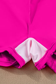 a close up of a pink and white shorts
