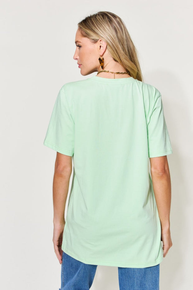 a woman wearing a mint green top