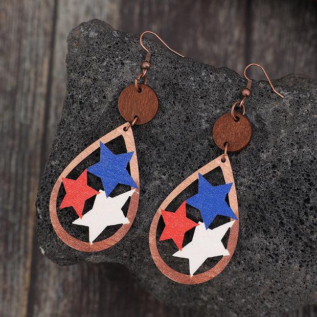 a pair of earrings with red, white and blue stars