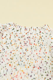 a white shirt with multicolored dots on it