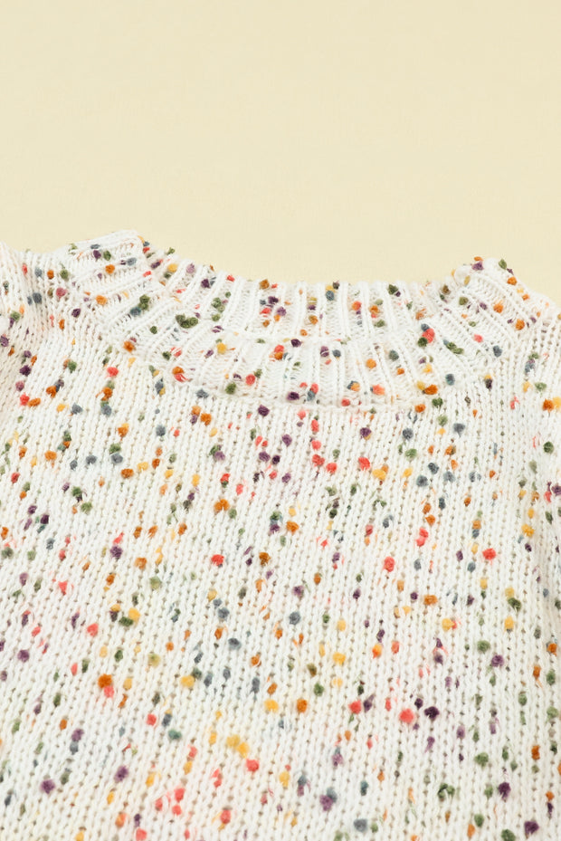 a white shirt with multicolored dots on it