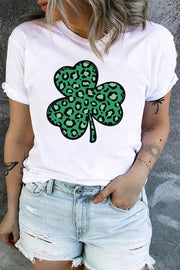 a woman wearing a white shirt with a green clover on it