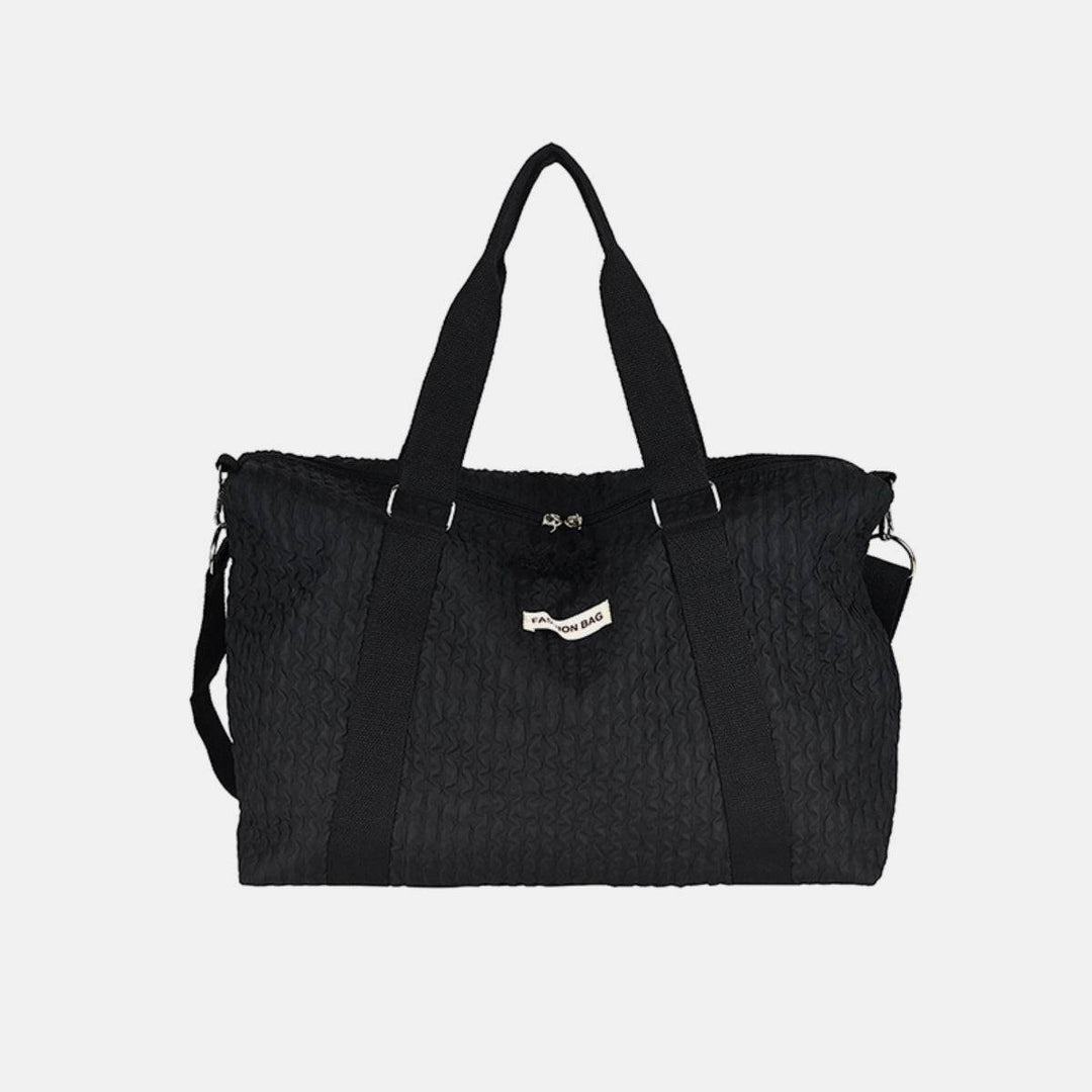 a black handbag on a white background