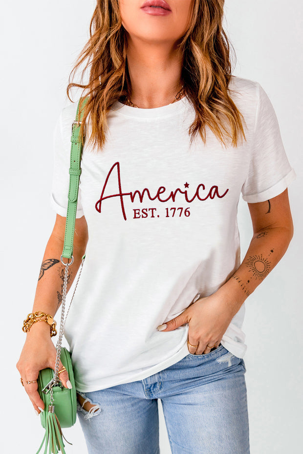 a woman wearing a white shirt with the word america on it