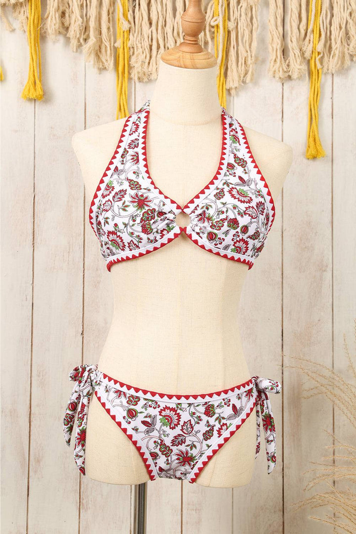 a mannequin wearing a bikini top with a floral print