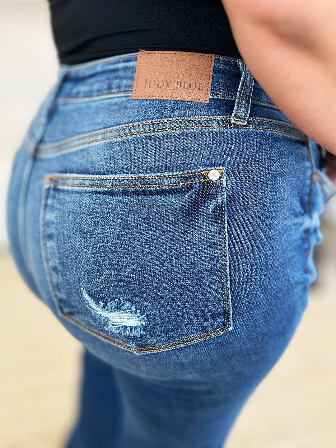 a close up of a person wearing a pair of jeans