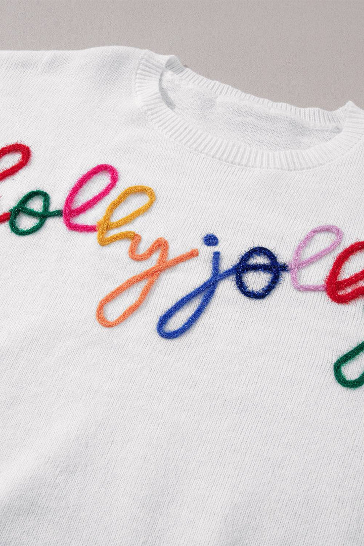 a white t - shirt with the word yolo spelled in multicolored yarn