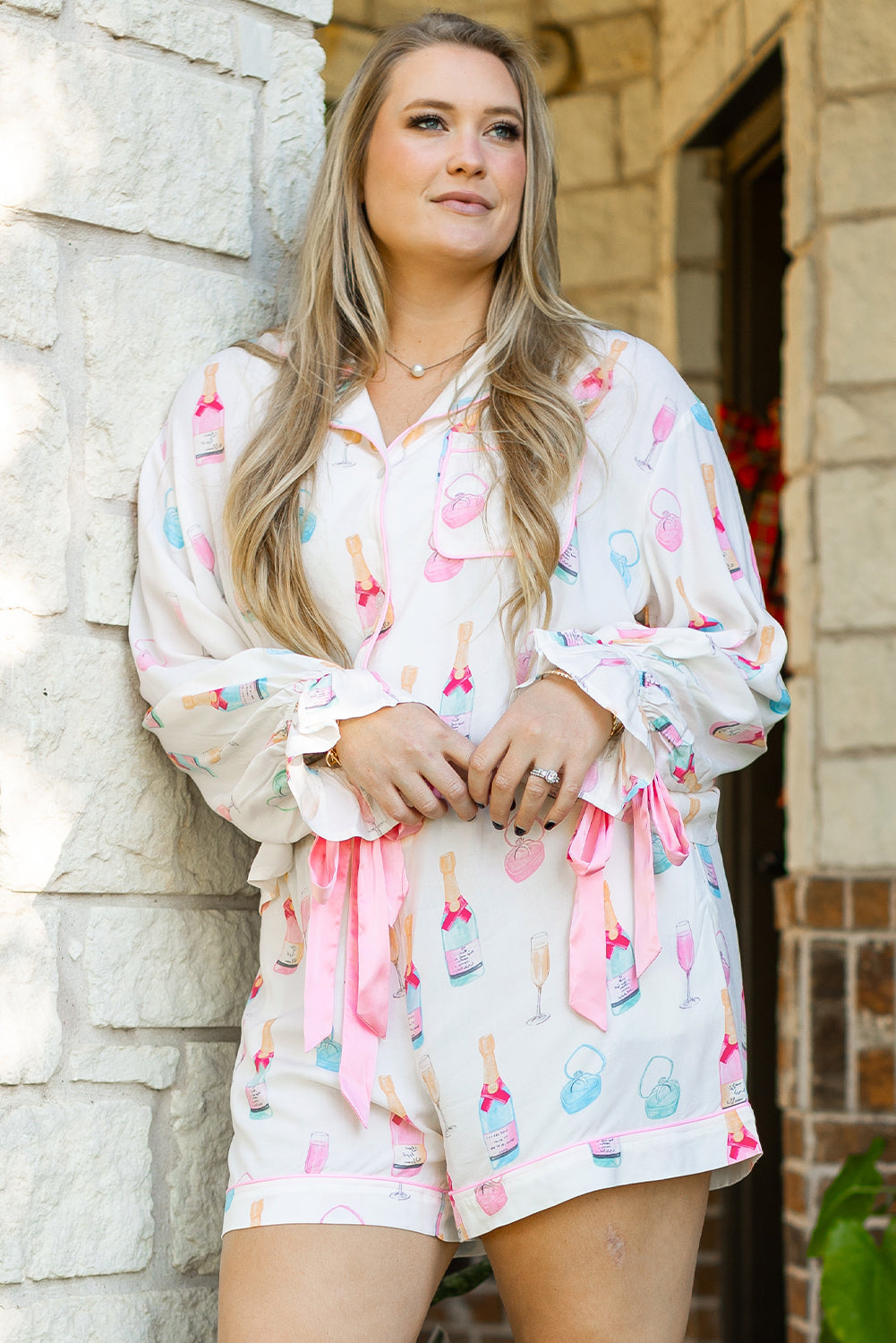 Shop White Plus Size Wine Glass Print Bow Knot Pajama Set at Faith & Co. Boutique, featuring playful wine bottle and glass prints with pink bow accents.