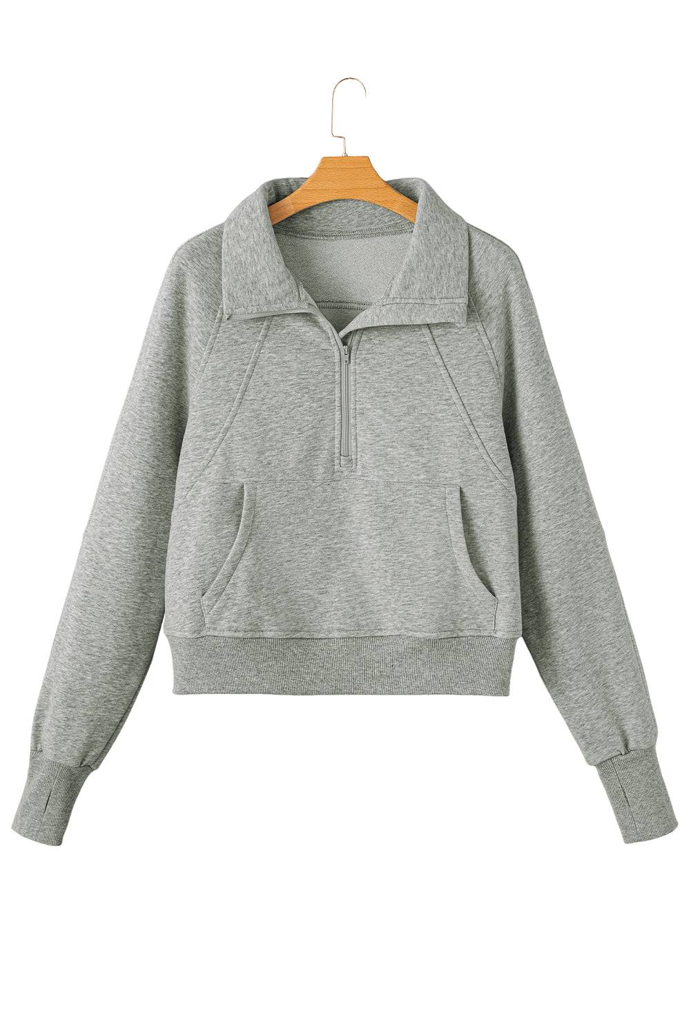 a grey sweatshirt with a hoodie on a hanger