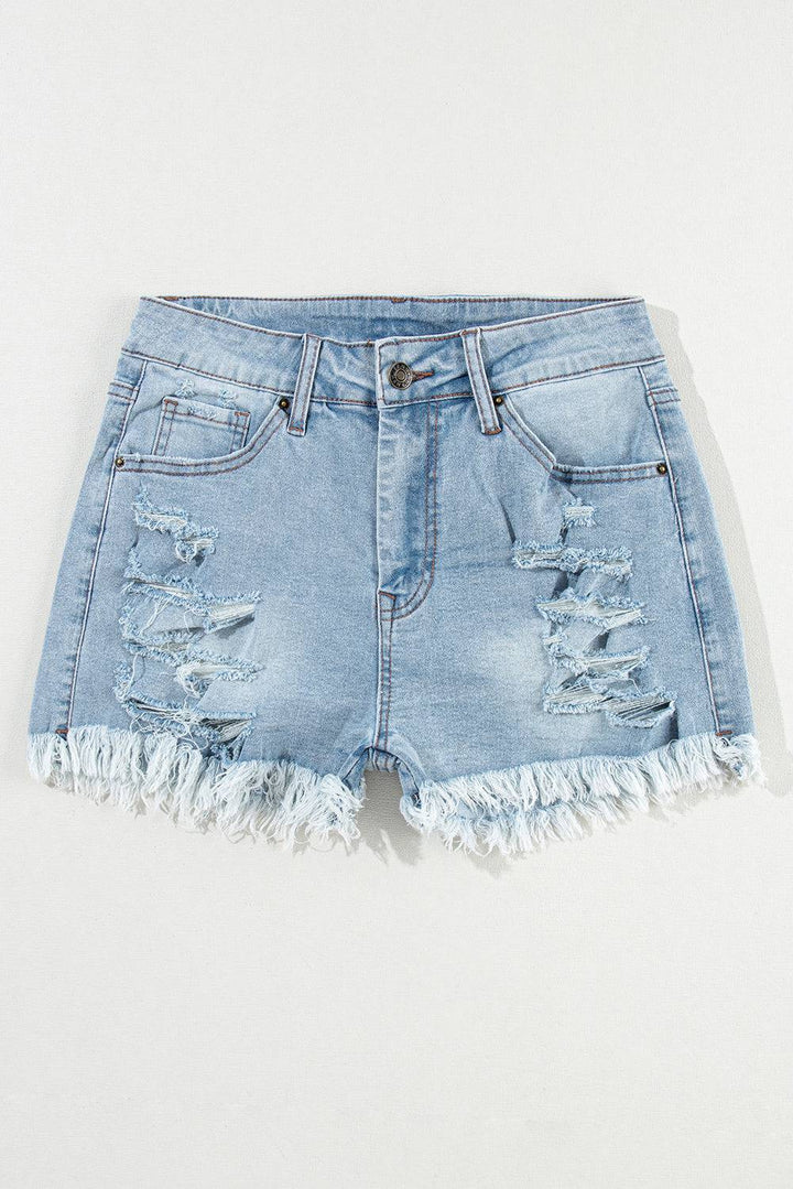 a pair of light blue denim shorts with frays