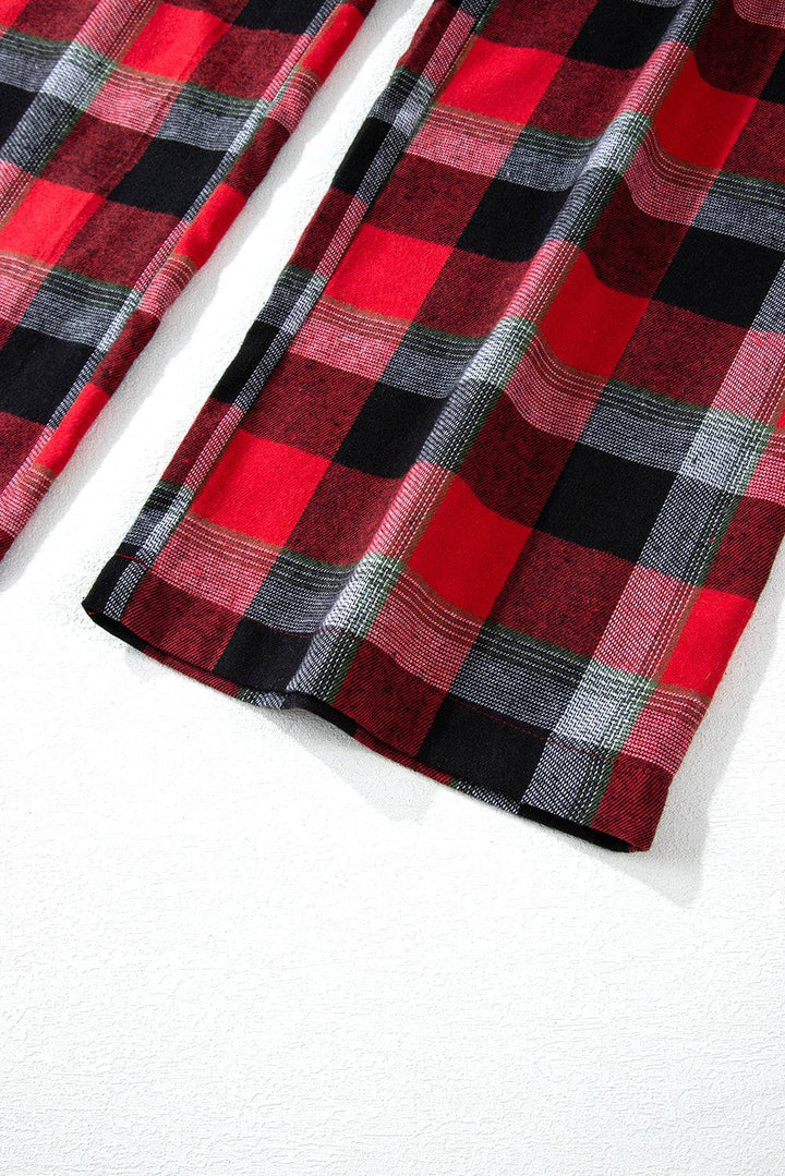 a red and black checkered shirt laying on a white surface