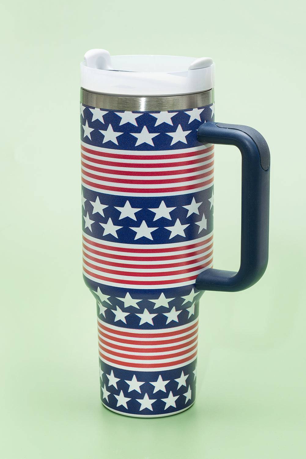 a coffee cup with a handle decorated with stars
