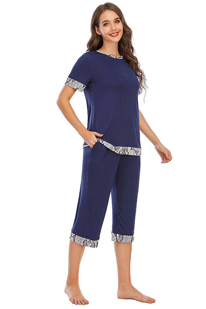 a woman wearing a blue pajama set