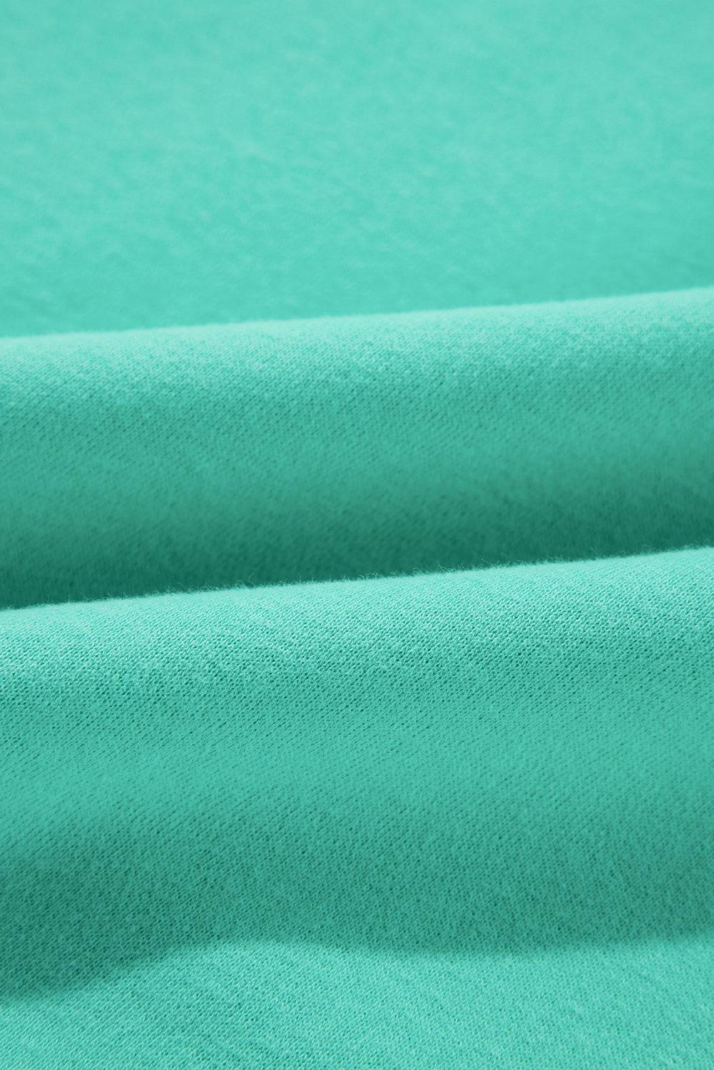 a close up shot of a green fabric