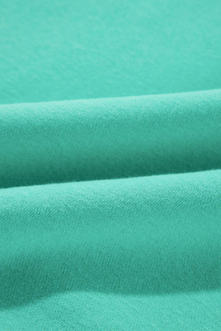 a close up shot of a green fabric