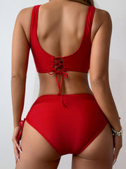 a woman in a red bikini top and panties