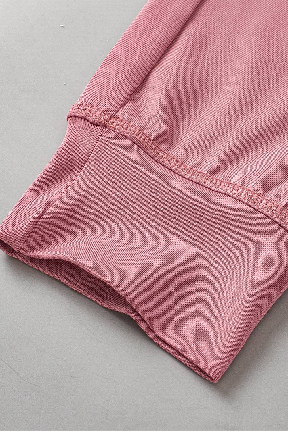 a close up of a pink shirt on a table