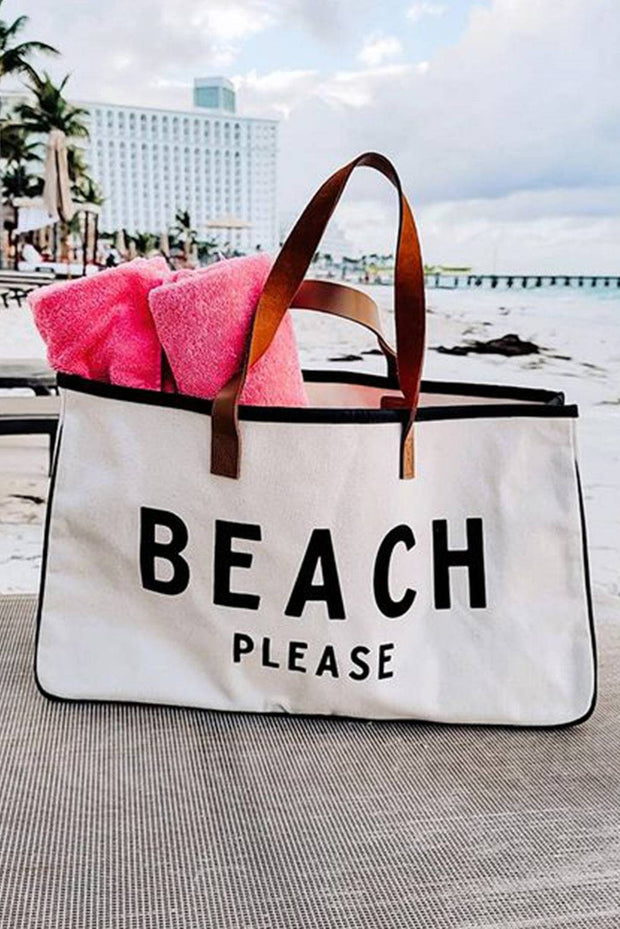 a beach bag sitting on top of a sandy beach