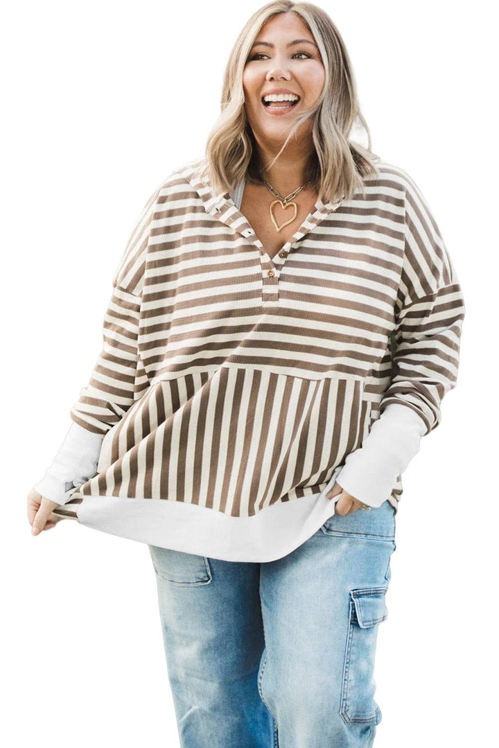 a woman wearing a striped shirt and jeans