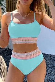 a woman in a blue bikini top and matching panties