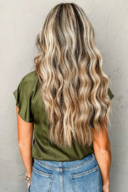 the back of a woman's head with long, wavy hair