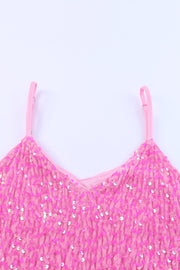 a pink top with sequins on it