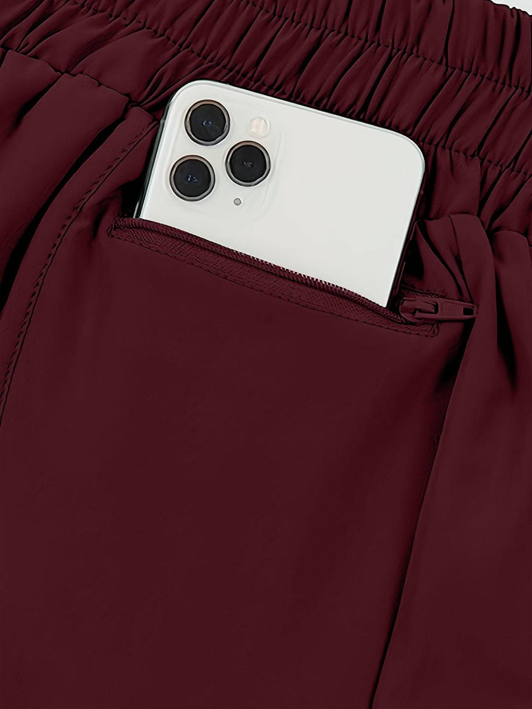 a cell phone sticking out of the pocket of a pair of pants