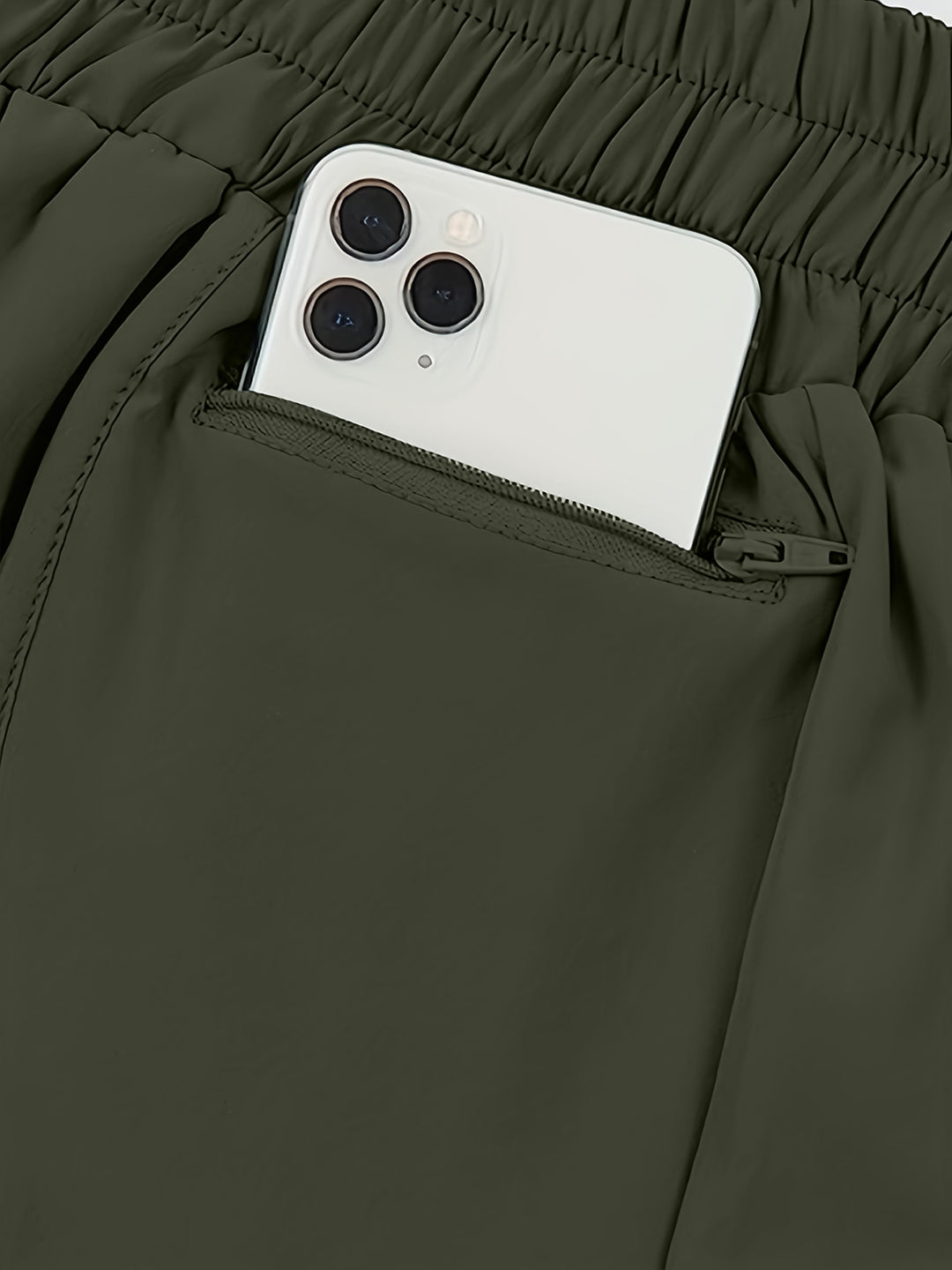 a cell phone sticking out of the pocket of a pair of pants