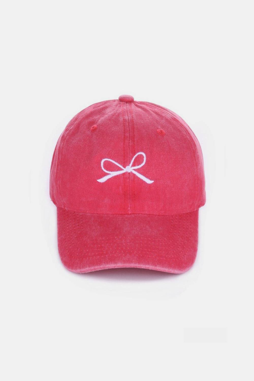a red hat with a white bow on it
