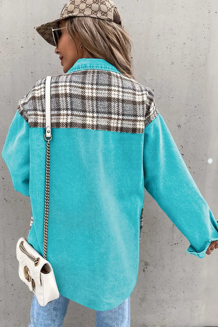 a woman wearing a blue jacket and hat