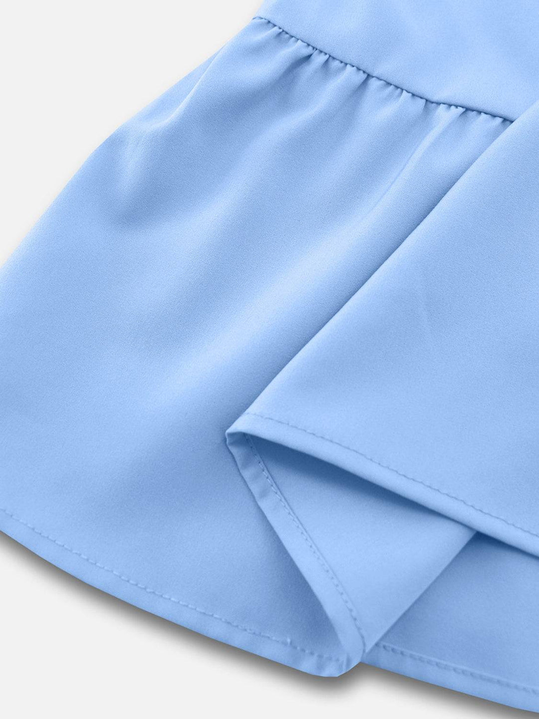 a close up of a blue skirt on a white background