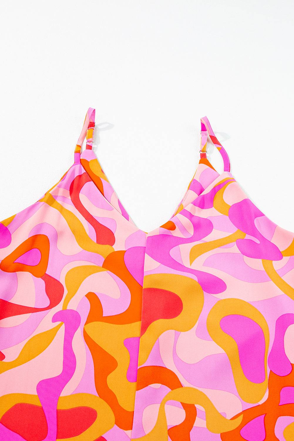 a pink camo print halter top on a white background