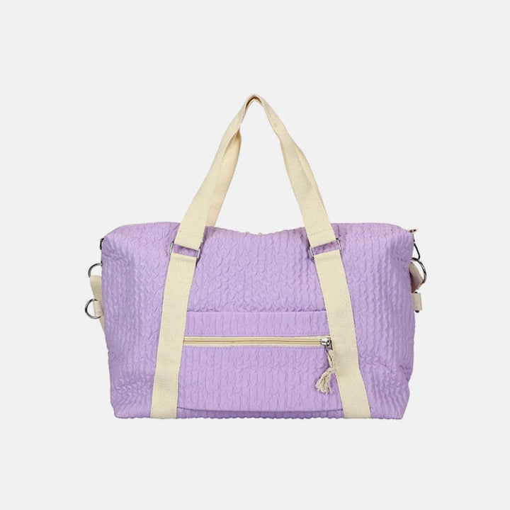 a purple handbag with a yellow strap