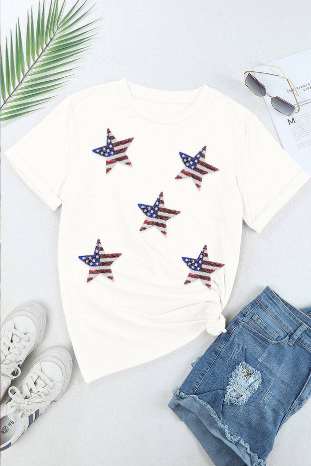 a t - shirt with american flags on it next to a pair of shorts