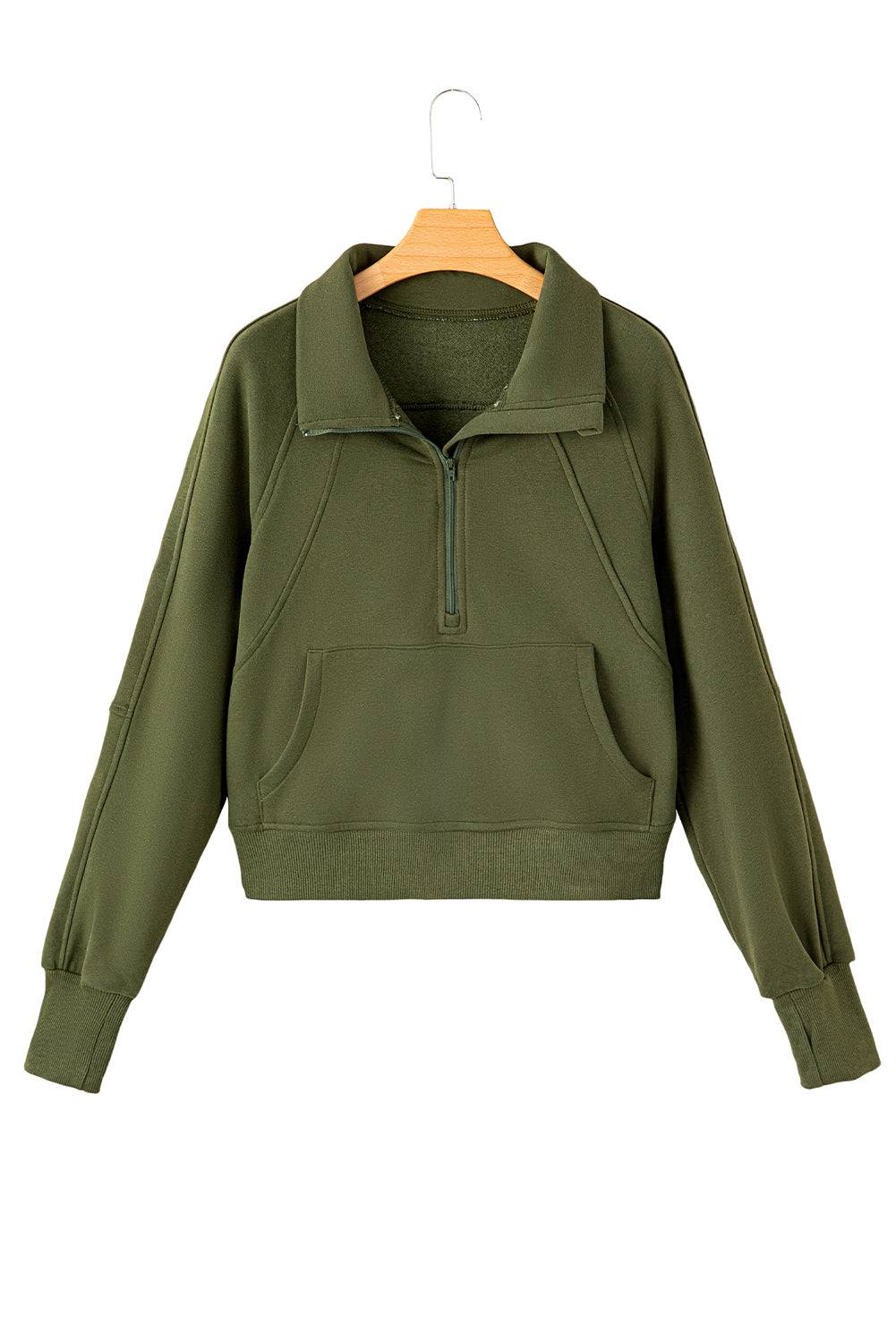 a green cropped sweatshirt with a zipper